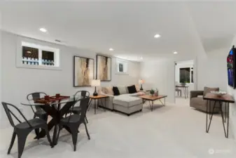 Expansive bonus room in the newly fully finished basement, offering tons of space and amenities such as a full bath, 2 bedrooms and laundry room.