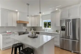 Get ready to cook and entertain in your brand new kitchen Offering slab quartz countertops and backsplash. Sparkling new appliance package, eat-in kitchen with large island.