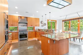 Kitchen features a Miele espresso maker, steam oven, and stove/range, plus a warming drawer in addition to a built-in Teppanyaki grill, and Subzero refrigerator