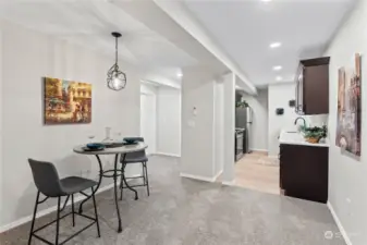 B/Lower Floor: Dining Room w/View of Kitchen and Hallway to Beds and Bath.