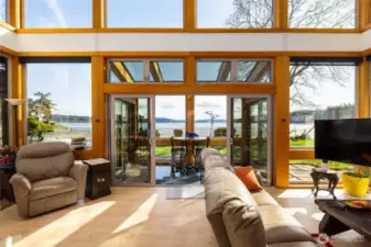 Living room slider opens to sun-room and the great outdoors... Windows equipped with great coverings...