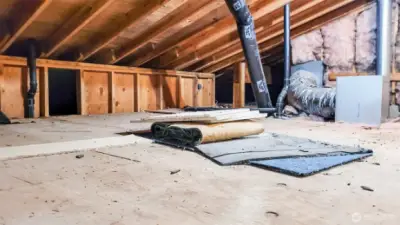 Interior of garage not shown as sellers are still moving out. This area is accessible through the garage & also the lower basement area. Immense storage space & this area holds the Furnace.