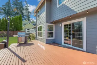 Large stained deck for all your gatherings. Grass enhanced.