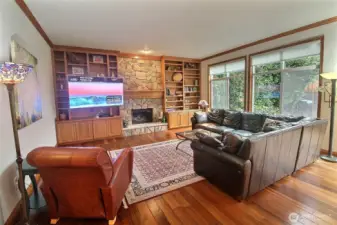 The other half of the Great Room. Built-in Bookcase, rock Fireplace center, just about floor to ceiling windows, 10' ceilings!