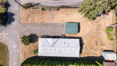 Great aerial view highlighting the home and its surrounding landscape.