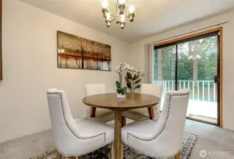 Dinnigroom with access to your spacious deck to enjoy BBQs or drinking a cup of cofee while watching nature in your back yard.