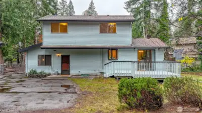 Rear side of the home with lovely deck for entertaining