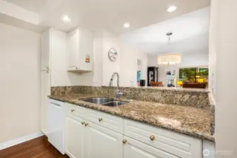 Kitchen view toward dining and living areas, highlighting the open-concept layout.