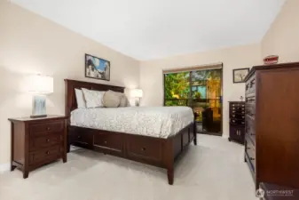 The primary bedroom offers restful comfort with tree views and room for full-size furniture.