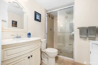 Walk-in shower with tile surround and built-in niche offers a spa-like experience.