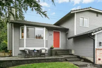 A beautiful front porch with room for sitting with a cup of coffee and the morning paper while watching the world go by