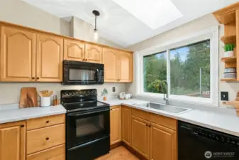 Skylight in the kitchen adds even more stunning light into the south side of the house!