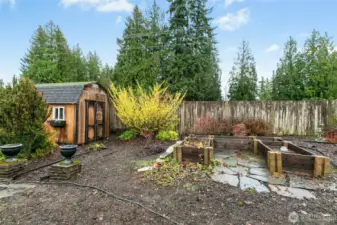 Large and beautiful shed and garden bed.