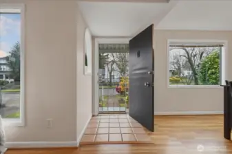 Entry, hardwood floors, coved ceilings