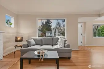 Living room, hardwood floors, wood fireplace, coved ceilings