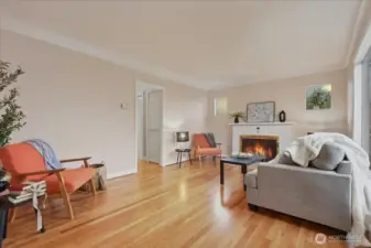 Living room, hardwood floors, wood fireplace, coved ceilings