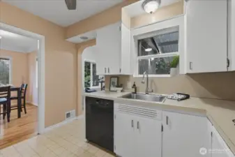 Kitchen, gas stove, built-in microwave, dishwasher, free-standing fridge, ceiling fan