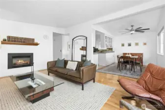 Living room opens to dining and kitchen with classic MCM pitched ceiling!