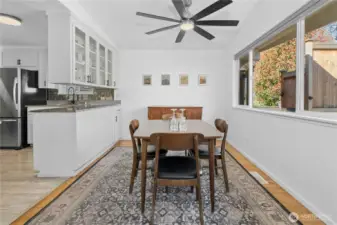Large dining area perfect for large gatherings and looks into front yard.