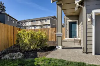 Covered front porch and side yard