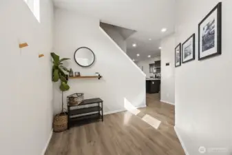 Cute entryway & greeted by newer LVP flooring