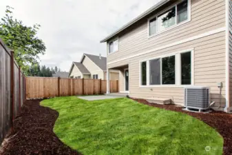 Fully landscaped and fenced home. Home includes High efficiency 5-stage heat pump unit.   Picture of a similar home. Photo for illustration only.
