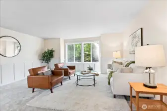 Formal Living Room just off the entry.  Beautiful wainscot and brand-new carpet.