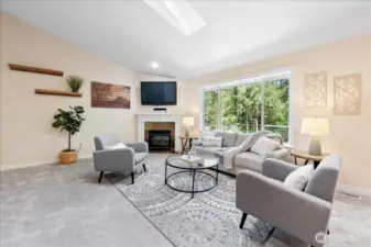 A large picture window overlooks the entertainment sized deck and backyard.