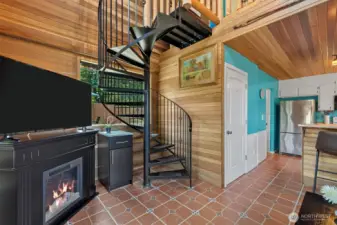 Spiral staircase to sleeping loft and 1/2 bath.