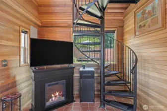 Spiral stairs up to the sleeping loft.