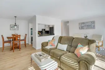 Spacious living room flows into separate dining area