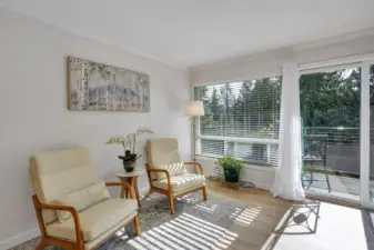 Cozy reading nook capitalizes on all the natural light and the pretty outlook.