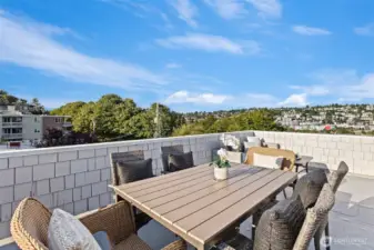 The expansive rooftop deck has views in all directions and room for both dining and living room furniture