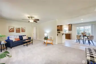 Open concept from the living room, dining area and kitchen. Slider from the dining area to spacious back patio.