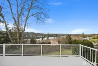 Expansive deck for gatherings spans full main floor exterior. The solid decking membrane allows for patio use below.