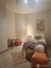 Secondary bedroom on main with morning light.