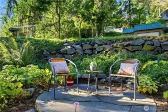Small seating area in front of house.