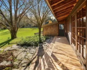 On the south side of the home, a private patio connects the main level bedrooms and guest bath.