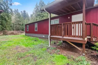 Side view of home showing lot space and outdoor area.