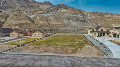 This .83-acre waterfront parcel offers a beautifully level building site