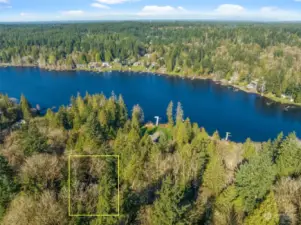 This 0.55-acre parcel boasts a stunning elevated position, providing captivating views from its sloped terrain.