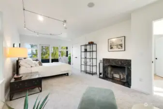 This bedroom has a gas fireplace and balcony