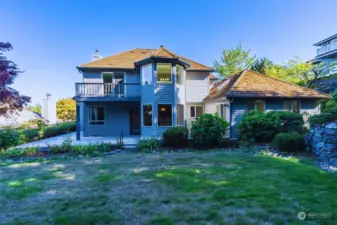 This home is surrounded by meticulous landscaping.