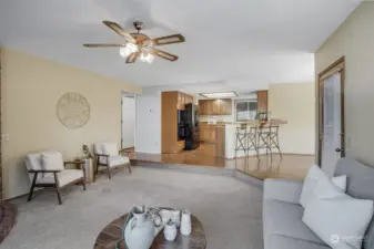 Open concept family room and kitchen area. Bar counter seating is perfect for breakfast time.