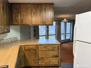 The kitchen overlooks the living room and dining area.