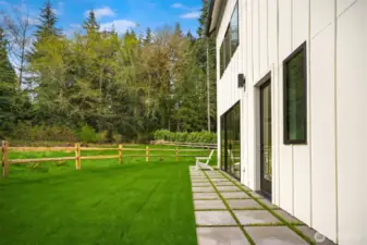 The fence demarcates the landscaped area and where the buffer begins.