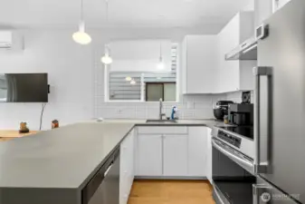 Modern kitchen equipped with plenty of storage and full sized appliances.