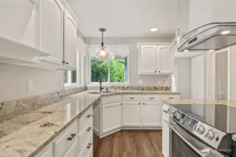 Light and bright kitchen! Beautiful hood and glass top stove/range!
