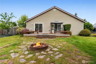 Backyard is landscaped and offers fruit trees and is fully fenced.