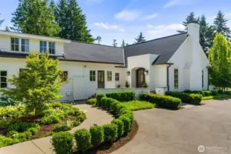 Follow the charming path from your three-car garage to the welcoming front door.